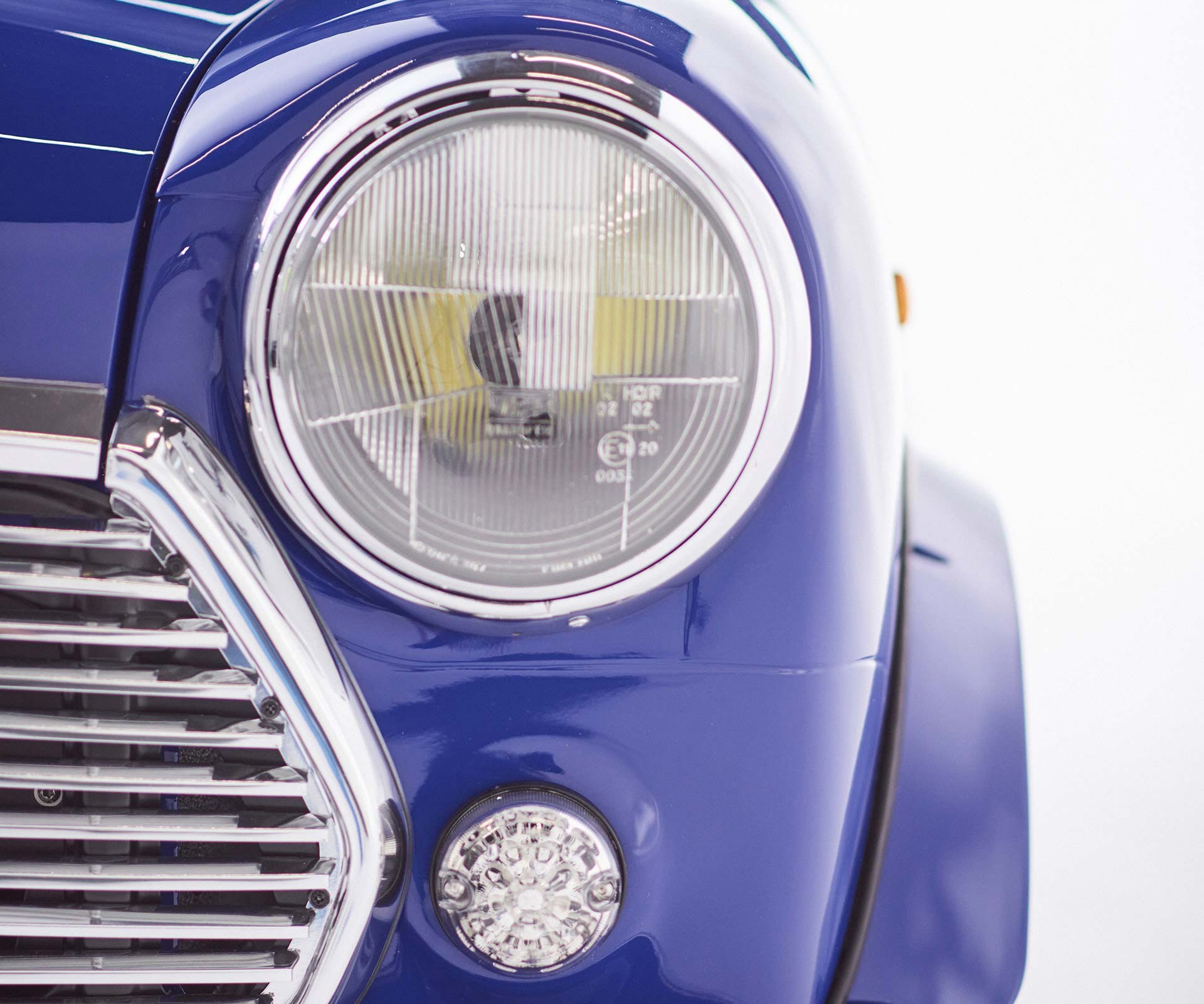 Close-up of a headlight of the MINI Recharged model.